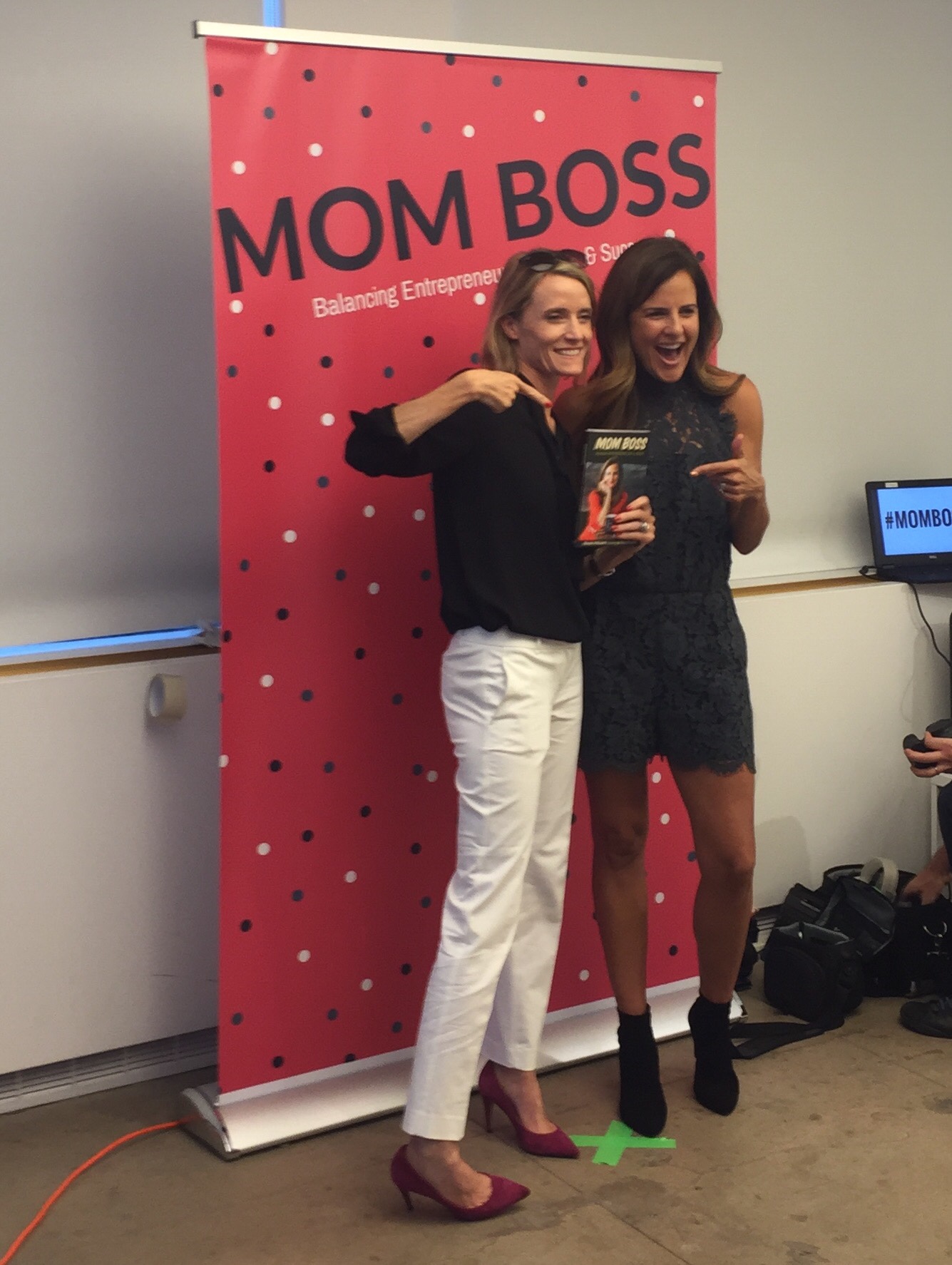  Carley Roney and Mom Boss author Nicole Feliciano pose at the book launch party. 
